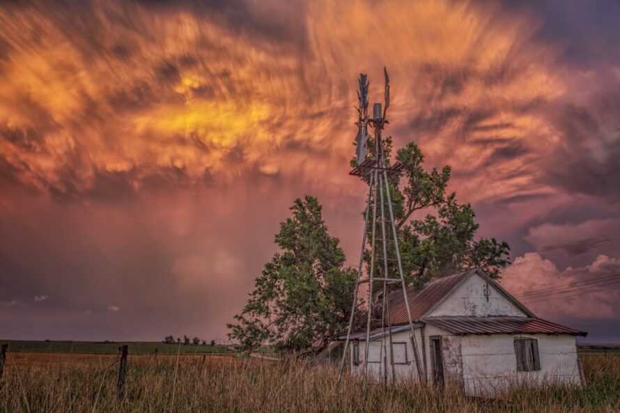 Mammatus from a dying thunderstorm streaks across the setting sun in Harper County Oklahoma